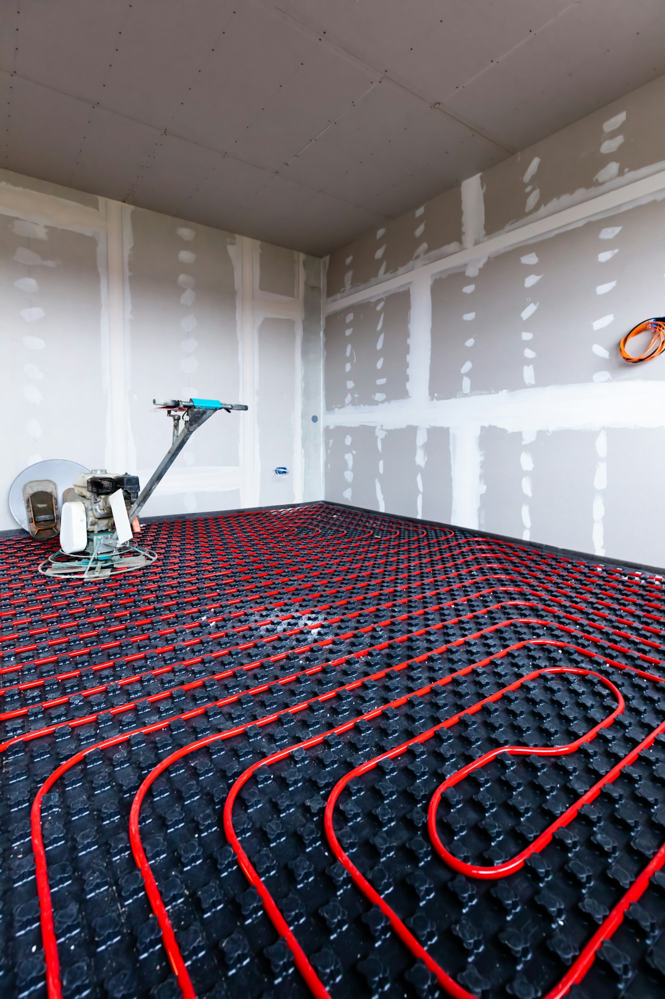 Floor heating in a new building. Interior design and finishing industry